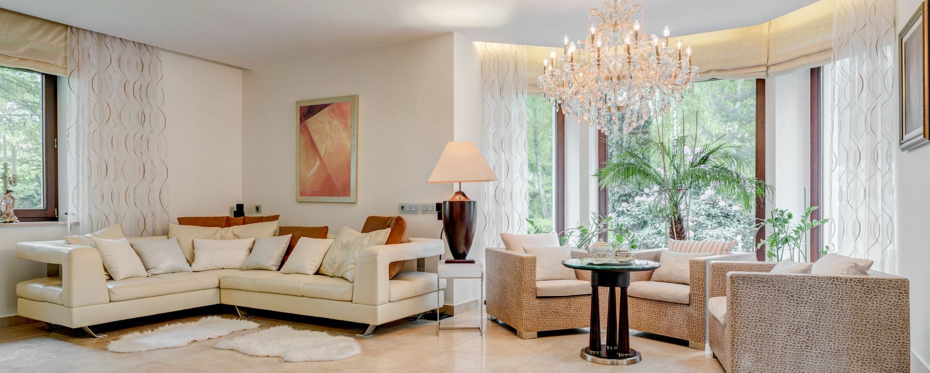 Spacious living room with Roman window shades and curtains