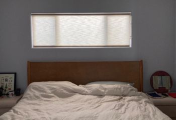 Cupertino bedroom window fitted with custom sheer pull down window shades, gently diffusing natural light for comfort and privacy.